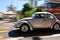 Vitange silver Beatle car driving in the streets of Rio de Janeiro, Brazil