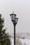 Vitebsk, Belarus, January 5, 2024. Vintage lanterns against the backdrop of a city landscape.