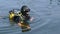 Vitebsk, Belarus, May 2017. Professional scuba diver in diving suit in water, diving work