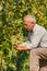 Viticulturist showing grape cluster