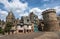 Vitre medieval old town buildings and stone wall.