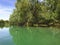 A vitro mirror of a calm river heading towards Skadar lake