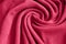 Viva magenta color of the year 2023, ribbed texture of cloth. Fabric textile pattern.