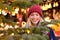 Vivacious happy young woman at a Christmas market