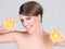 Vivacious playful woman with fresh orange slices