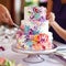 Vivid and Attention-Grabbing Image of Cake Cutting and Dining