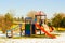 Vivid colors, empty childrens playground in winter time.