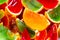 Vivid colour, red, green, orange, jelly in oranges peel