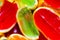 Vivid colour, red, green, orange, jelly in oranges peel