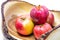 Vivid and fresh couple of red apples in wooden basket