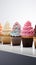 Vivid lineup cupcakes stand out individually against a clean white isolation