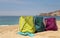 Vivid multicolored beach bags on the seashore