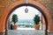 Vivid of Murcia cityscape through frame of old architecture arch of bricks in la Fuensanta, at the mountain top