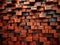 Vivid orange bricks arranged in a dynamic pattern on a wall.
