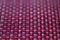 Vivid red basket weave mesh texture background with limited focus