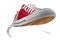 Vivid red vintage canvas sports shoes with laces, suitable for playing basketball, tennis or running, isolated on white with