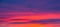 Vivid saturated beautiful sunset sky in orange, purple and red colors. Sunset background