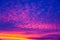 Vivid saturated beautiful sunset sky in pink, purple and blue colors. Abstract amazing sunset background