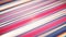 Vivid striped textile in shades of pink, magenta, electric blue, and violet