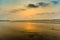 Vivid sunrise on a serene calm tranquil deserted beach at digha puri mandarmanivivid sunrise on a serene calm tranquil deserted be