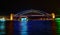 Vivid Sydney- boats cruise by Sydney Harbour Bridge in colour