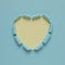 Vivid torn paper heart on bright background. Minimal love or like concept.