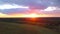 Vivid, vibrant sunset above green rural countryside fields and trees. Clip, Breathtaking sunset sky above summer forest