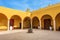 Vivid yellow colonnade under blue skies in Mexico