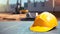 Vivid Yellow Construction Helmet with Copyspace on Blurred Construction Site Background