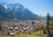 Viwe from Kranzberg hillside to the tourist spa town Mittenwald and karwendel mountains, spring landscape bavaria