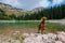 Vizsla Dog in Pointing Stance by Mountain Lake