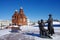 Vladimir, Russia - March, 2021: Ancient city street in winter sunny day. Trinity Church and Monument to Provincial Actors