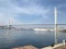 Vladivostok. Golden bridge  cable-stayed bridge over  Golden horn Bay in may morning and  fragment of the embankment of  Tsarevich