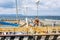 Vladivostok, Russia, 09/20/2017: An elderly captain at the pier in the marina is preparing a boat. Beautiful seascape on a sunny