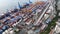 Vladivostok, Russia - August 9, 2021: Top view. Commercial Sea Port. Industrial port with containers.