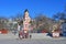 Vladivostok, Russia, January, 03, 2019. Tourists walk in front of the chapel in the name of St. Andrew and the memorial in memory