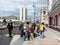 Vladivostok, Russia, May, 22, 2019. People came out of the underground pedestrian crossing and walking past the saleswoman lilies