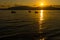 VLORA - VLORE, ALBANIA: Beautiful sunset on the sea, silhouettes of fishing boats.