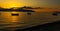 VLORA - VLORE, ALBANIA: Beautiful sunset on the sea, silhouettes of fishing boats.