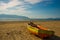 VLORA - VLORE, ALBANIA: View of the beach and the fisherman's boat, the islands on the horizon in the city of Vlora.