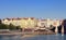 Vltava river in Prague with boats and view on historical european architecture. Cityscape of Prague