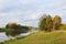 Vltava river with ship harbour and autumn trees. Czech landscape