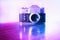 Vntage pink and purple rangefinder camera background