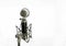 Vocal condenser microphone with wind screen on white background