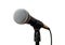 Vocal microphone with cord on a stand closeup isolated