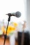 Vocal Microphone in focus against blurred audience at the conference