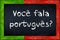 Voce fala portugues blackboard with portugal flag frame
