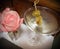 Vodka Martini with olives next to a pink rose.