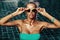 Vogue style fashion portrait of beautiful chic woman in water