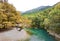 Voidomatis river in aristi village trees rafting boats in autumn season